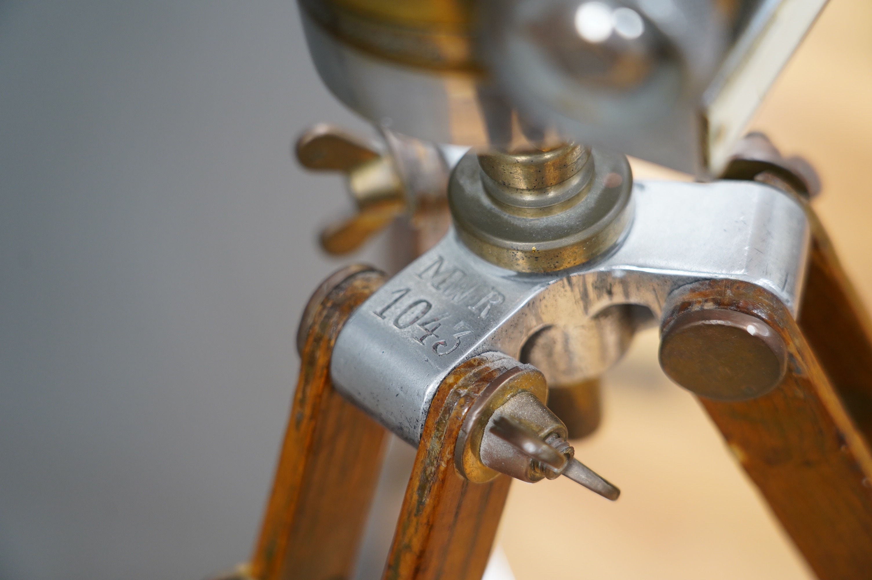 A pair of Czech army polished alloy and brass ‘donkey ears’ trench binoculars, stamped ‘ASZT. 10x45 522660 41 1956’, together with the correct oak tripod stand. Condition - fair to good